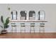 Brightly-lit dressing room, featuring multiple mirrors, chairs, and hardwood floors at 8102 E Cambridge Ave, Scottsdale, AZ 85257