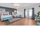 Bright bedroom with two beds, stylish decor, and French doors at 8102 E Cambridge Ave, Scottsdale, AZ 85257