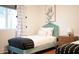Tastefully decorated bedroom features twin bed, stylish decor, natural light, and modern furnishings, creating a cozy and inviting space at 8102 E Cambridge Ave, Scottsdale, AZ 85257