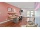 Open game room with shuffleboard table, bar seating, and modern decor at 8102 E Cambridge Ave, Scottsdale, AZ 85257
