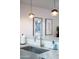 Close-up of a kitchen bar featuring a stainless steel sink, modern faucet, and stylish pendant lighting, creating an efficient workspace at 8102 E Cambridge Ave, Scottsdale, AZ 85257