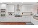 Well-lit kitchen featuring stainless steel appliances and white cabinetry at 8102 E Cambridge Ave, Scottsdale, AZ 85257