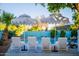 An inviting pool area with lounge chairs and umbrellas offers relaxation in style at 8102 E Cambridge Ave, Scottsdale, AZ 85257