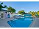 A refreshing swimming pool is framed by lush landscaping and poolside lounging at 8102 E Cambridge Ave, Scottsdale, AZ 85257
