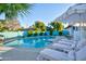 A sparkling swimming pool with lounge chairs and a shaded umbrella offers backyard bliss at 8102 E Cambridge Ave, Scottsdale, AZ 85257