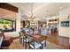 Elegant dining area with a chandelier and outdoor view into living areas and kitchen at 8154 E Tecolote Cir, Scottsdale, AZ 85266