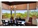 Sunlit dining room with beautiful views of the landscape and stylish furnishings at 8154 E Tecolote Cir, Scottsdale, AZ 85266