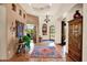 Grand foyer with tile flooring, chandelier, artwork and an arched entryway to other rooms at 8154 E Tecolote Cir, Scottsdale, AZ 85266