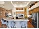 Spacious kitchen with large marble island, wooden cabinetry, stainless appliances and an open design at 8154 E Tecolote Cir, Scottsdale, AZ 85266