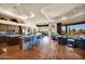 Open concept design featuring tile floor, kitchen with island, living room area and outdoor view at 8154 E Tecolote Cir, Scottsdale, AZ 85266