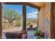 Relaxing outdoor patio with comfortable seating and views of the desert landscape at 8154 E Tecolote Cir, Scottsdale, AZ 85266