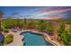 Inviting pool with lounge chairs surrounded by desert landscaping, offering a serene outdoor oasis at 8154 E Tecolote Cir, Scottsdale, AZ 85266