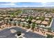 Aerial view of a suburban neighborhood with tree-lined streets and well-maintained homes at 838 W Basswood Ave, Queen Creek, AZ 85140