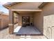 View of the back patio with double doors and neutral colors at 838 W Basswood Ave, Queen Creek, AZ 85140
