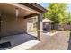 This backyard is landscaped with desert rock and artificial turf and features a covered patio and gazebo at 838 W Basswood Ave, Queen Creek, AZ 85140