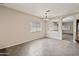 Dining room with tile floors, a modern chandelier, and views into the adjacent rooms at 838 W Basswood Ave, Queen Creek, AZ 85140