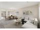 Bright living room with large sectional sofa and dining area, perfect for Gathering gatherings at 838 W Basswood Ave, Queen Creek, AZ 85140