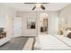 Inviting main bedroom showcasing ceiling fan and ensuite bathroom entrance at 838 W Basswood Ave, Queen Creek, AZ 85140