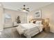 Serene main bedroom with large windows, ceiling fan and stylish decor at 838 W Basswood Ave, Queen Creek, AZ 85140