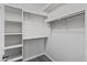 Spacious walk-in closet featuring built-in shelving and ample hanging space at 838 W Basswood Ave, Queen Creek, AZ 85140