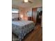 Charming main bedroom featuring a comfortable bed, calming decor, and an en-suite bathroom at 8600 E Broadway Rd # 91, Mesa, AZ 85208