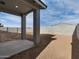 Backyard area with covered patio and block wall at 8634 W Albeniz Pl, Tolleson, AZ 85353