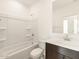 Bathroom featuring a shower-tub combo and modern vanity at 8634 W Albeniz Pl, Tolleson, AZ 85353