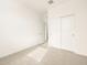 Bright bedroom features carpet and a closet with sliding doors at 8634 W Albeniz Pl, Tolleson, AZ 85353