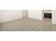 Bright, carpeted bedroom featuring neutral walls and ensuite bathroom at 8634 W Albeniz Pl, Tolleson, AZ 85353