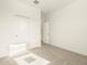 Carpeted bedroom featuring a closet with sliding doors and a neutral color palette at 8634 W Albeniz Pl, Tolleson, AZ 85353
