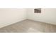 Bright bedroom featuring a carpeted floor, neutral walls, and ample outlets at 8634 W Albeniz Pl, Tolleson, AZ 85353