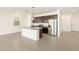 Well-appointed kitchen features granite counters, stainless steel appliances, and sleek cabinetry for a modern appeal at 8634 W Albeniz Pl, Tolleson, AZ 85353