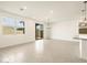 Open-concept living area boasts recessed lighting, modern fixtures, and a sliding glass door to an outdoor space at 8634 W Albeniz Pl, Tolleson, AZ 85353
