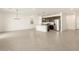 Spacious living area connects seamlessly to kitchen, perfect for entertaining, and bathed in natural light at 8634 W Albeniz Pl, Tolleson, AZ 85353