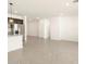 Spacious living room featuring neutral tile flooring, recessed lighting, and open floor plan perfect for entertaining at 8634 W Albeniz Pl, Tolleson, AZ 85353