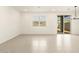 Inviting living space featuring large windows, recessed lights, and sliding glass door to a private backyard at 8634 W Albeniz Pl, Tolleson, AZ 85353