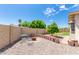 Serene backyard featuring a fire pit, desert landscaping, and a cozy seating area for outdoor enjoyment at 903 W Shawnee Dr, Chandler, AZ 85225