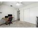 Bright bedroom includes a workspace, ample closet space, and a ceiling fan for added comfort at 903 W Shawnee Dr, Chandler, AZ 85225