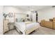Bright bedroom featuring a large bed and a closet with shelf space at 903 W Shawnee Dr, Chandler, AZ 85225
