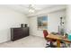 Bright bedroom featuring a workspace, neutral carpet, ample closet space and a ceiling fan at 903 W Shawnee Dr, Chandler, AZ 85225