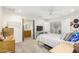 View of a bedroom with an ensuite bathroom and entertainment center with TV at 903 W Shawnee Dr, Chandler, AZ 85225