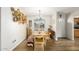 Dining room with hardwood floors and decorative baskets hanging on the wall at 903 W Shawnee Dr, Chandler, AZ 85225