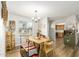 Dining room with hardwood floors showing a table and view to kitchen at 903 W Shawnee Dr, Chandler, AZ 85225