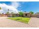 Single-story home with manicured lawn, desert landscaping, and an attached two-car garage at 903 W Shawnee Dr, Chandler, AZ 85225