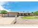 Charming single-story home with a well-maintained front yard and a two-car garage at 903 W Shawnee Dr, Chandler, AZ 85225