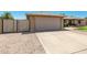 A single-story home with a two-car garage and low-maintenance gravel landscaping at 903 W Shawnee Dr, Chandler, AZ 85225