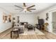 Comfortable living room featuring a large sectional sofa, ceiling fan, and open design at 903 W Shawnee Dr, Chandler, AZ 85225