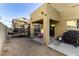 Backyard view, showing the covered patio, trampoline, and outdoor grill at 9415 W Eaton Rd, Phoenix, AZ 85037