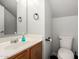 Bathroom featuring a single sink vanity and toilet at 9415 W Eaton Rd, Phoenix, AZ 85037