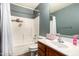 Bathroom with a shower/tub combo, single sink vanity, and neutral gray colored walls at 9415 W Eaton Rd, Phoenix, AZ 85037